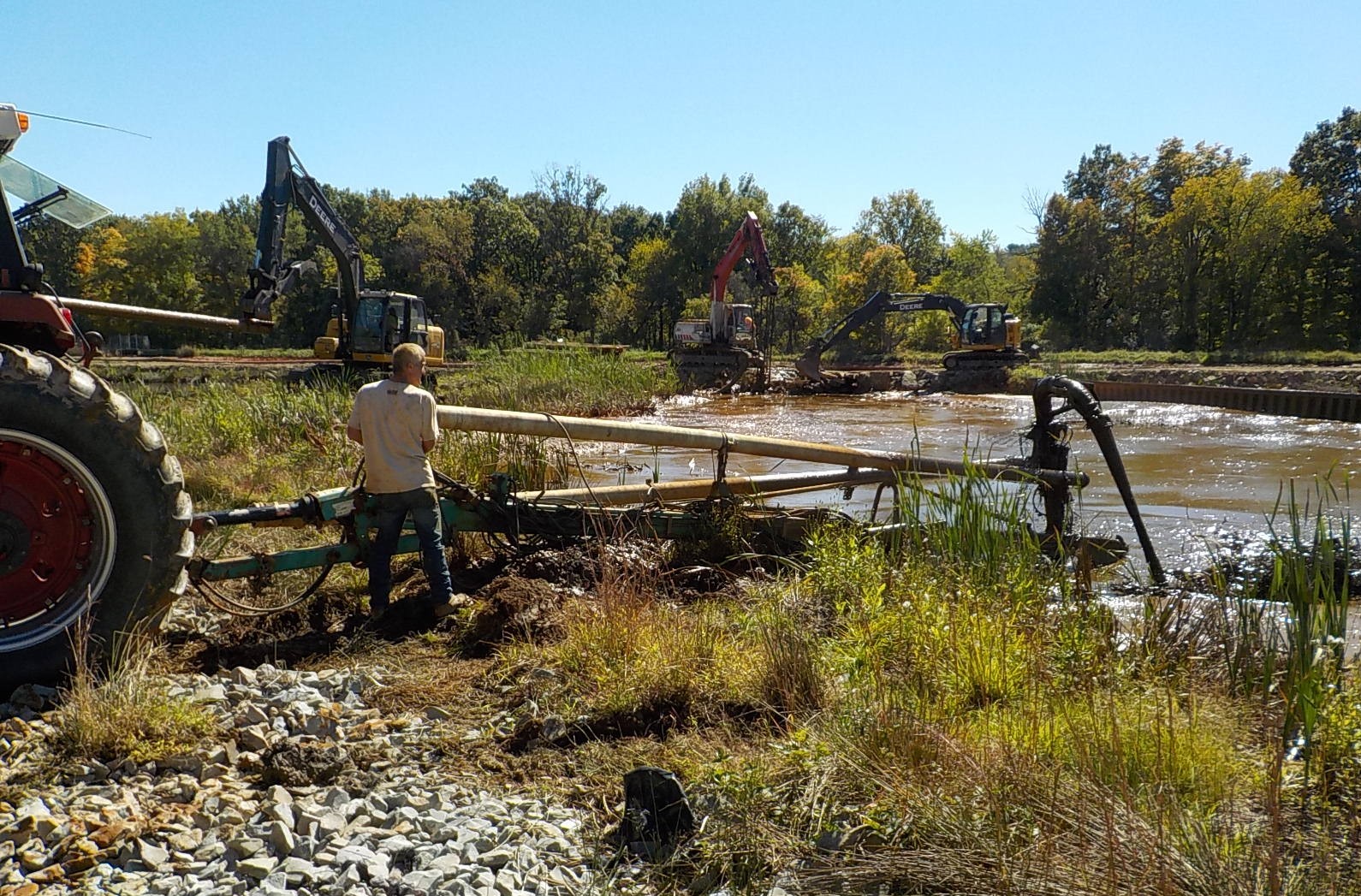 Brinkerton Abandoned Mine Treatment System in Mount Pleasant Township, Pennsylvania. Equipment is used to agitate and remove iron sludge from the retention ponds. Photo courtesy of Sewickley Creek Watershed Association. 