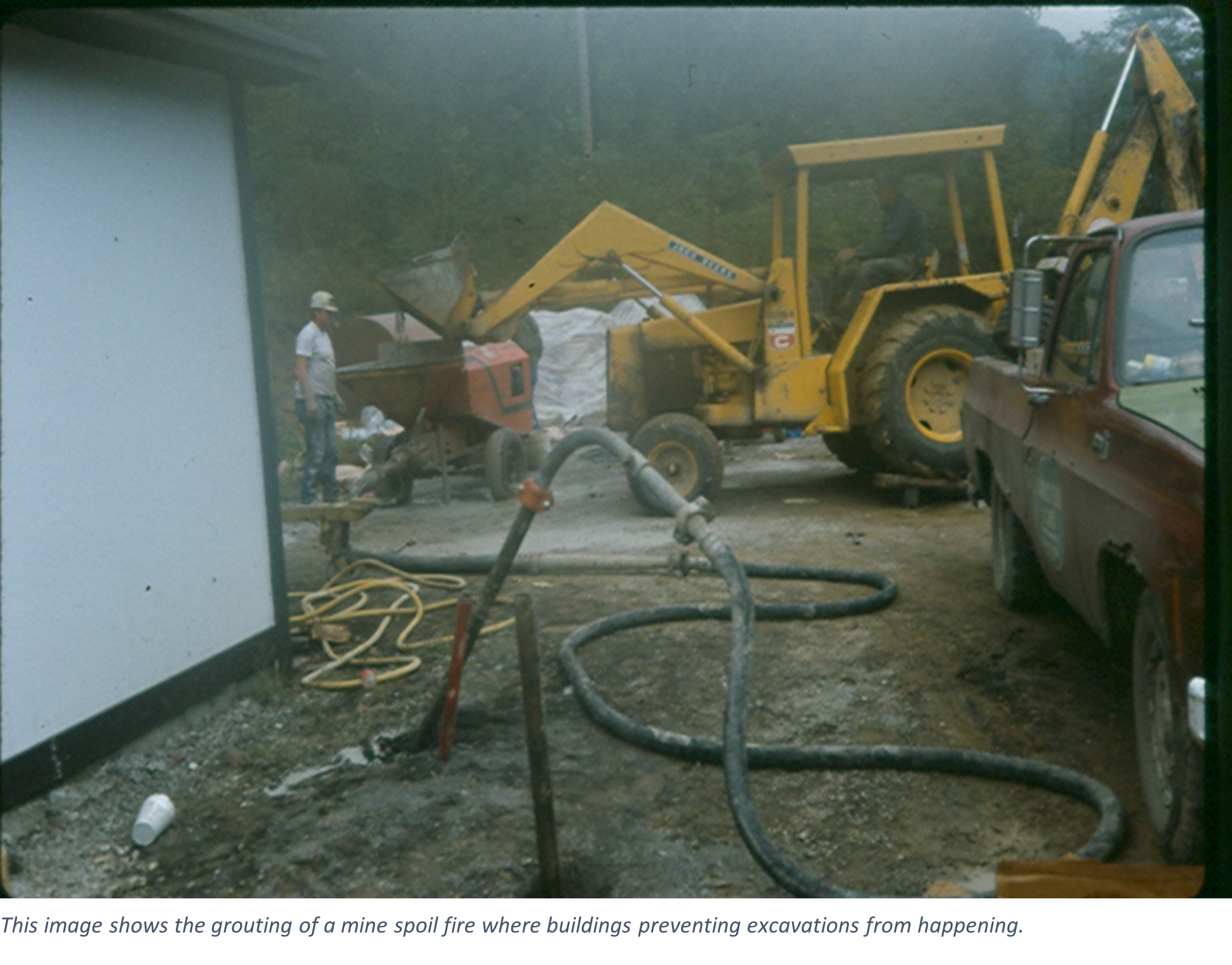 This image shows the grouting of a mine spoil fire where buildings preventing excavations from happening.