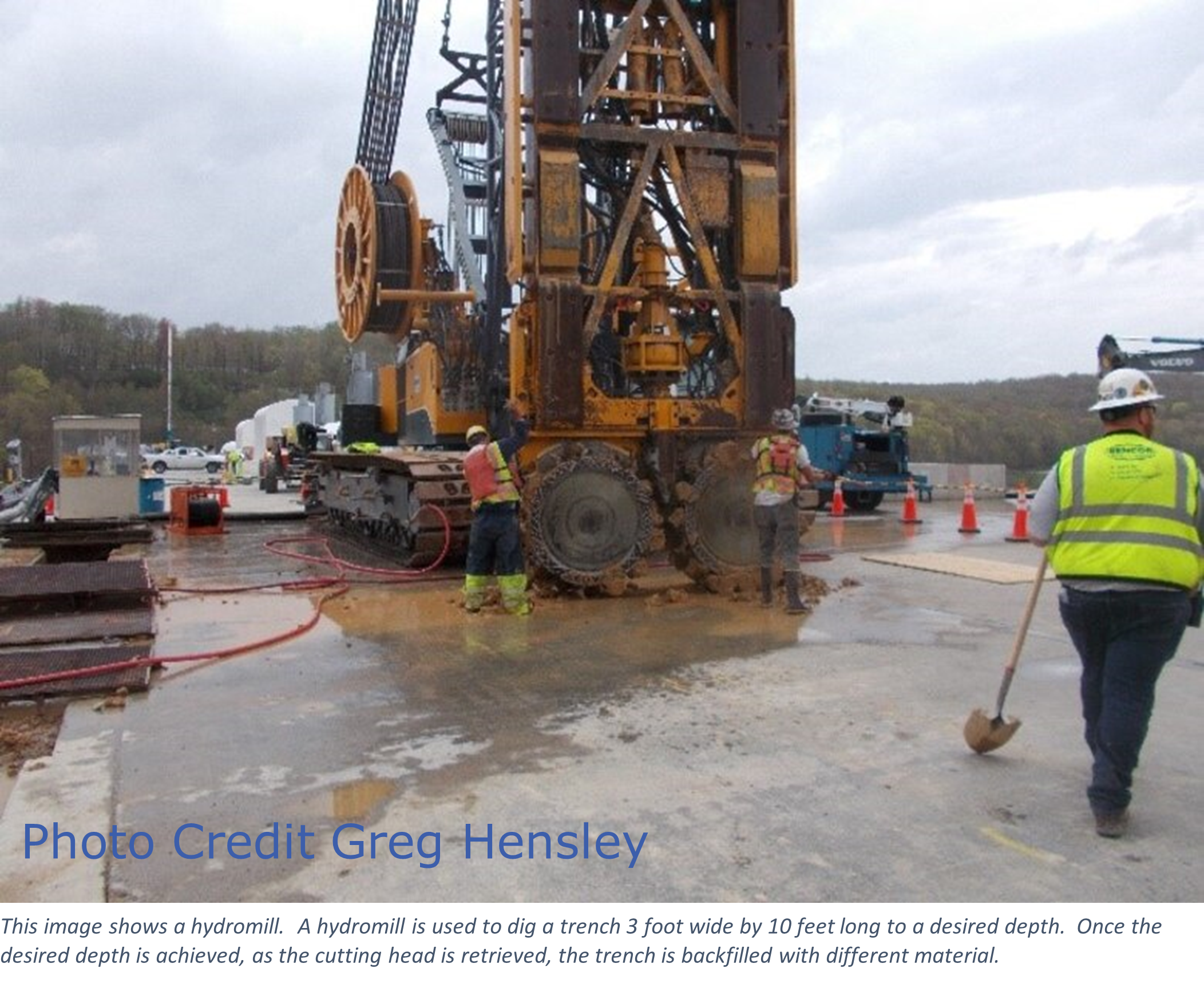 This image shows a hydromill.  A hydromill is used to dig a trench 3 foot wide by 10 feet long to a desired depth.  Once the desired depth is achieved, as the cutting head is retrieved, the trench is backfilled with different material.