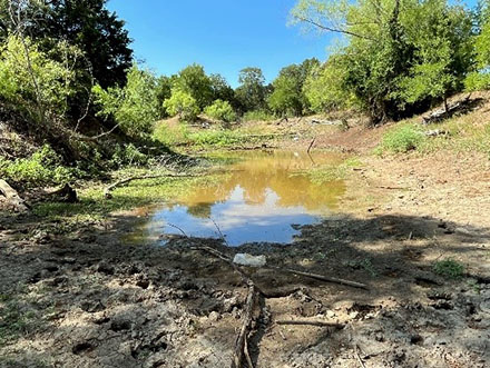 Funds are used for abandoned mine land reclamation projects like this one in Bastrop County, Texas, where flooding and drainage issues are being mitigated. Photo courtesy of Texas Abandoned Mine Land Program.